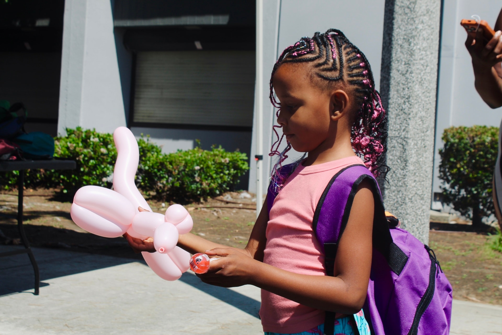 Children receiving backpacks at the Get It Together community giveaway
